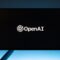 monitor screen with openai logo on black background