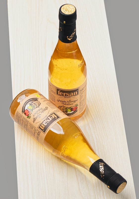yellow and white labeled bottle of vinegar